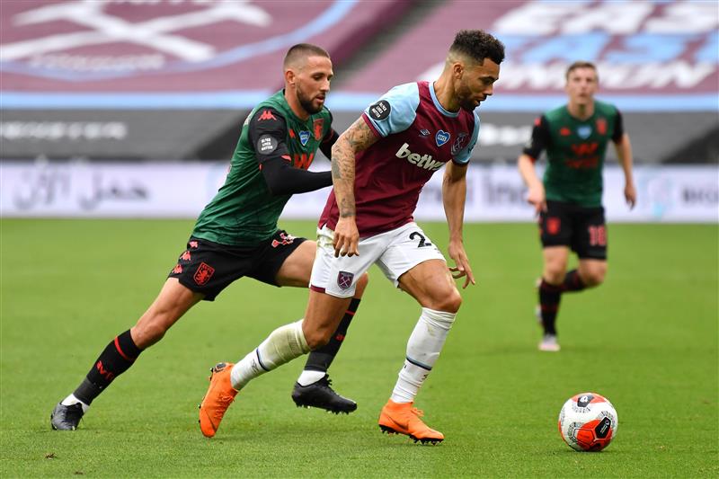 LONDON, ENGLAND - JULY 26: Ryan Fredericks of West Ham United and Conor Hourihane of Aston Villa  during the Premier League match between West Ham United and Aston Villa at London Stadium on July 26, 2020 in London, England. (Photo by Justin Setterfield/Getty Images)