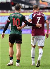 LONDON, ENGLAND - JULY 26: Jack Grealish of Aston Villa and Andriy Yarmolenko of West Ham United embrace during the Premier League match between West Ham United and Aston Villa at London Stadium on July 26, 2020 in London, England. (Photo by Justin Setterfield/Getty Images)