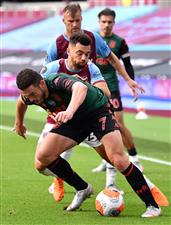 LONDON, ENGLAND - JULY 26: John McGinn of Aston Villa and Ryan Fredericks of West Ham United during the Premier League match between West Ham United and Aston Villa at London Stadium on July 26, 2020 in London, England. (Photo by Justin Setterfield/Getty Images)
