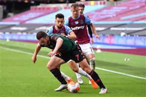 LONDON, ENGLAND - JULY 26: John McGinn of Aston Villa and Ryan Fredericks of West Ham United during the Premier League match between West Ham United and Aston Villa at London Stadium on July 26, 2020 in London, England. (Photo by Justin Setterfield/Getty Images)