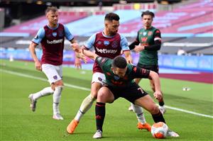 LONDON, ENGLAND - JULY 26: John McGinn of Aston Villa and Ryan Fredericks of West Ham United during the Premier League match between West Ham United and Aston Villa at London Stadium on July 26, 2020 in London, England. (Photo by Justin Setterfield/Getty Images)