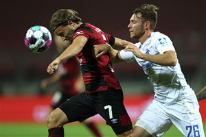 NUREMBERG, GERMANY - OCTOBER 05: Felix Lohkemper (L) of Nürnberg battles for the ball with Matthias Bader of Darmstadt during the Second Bundesliga match between 1. FC Nürnberg and SV Darmstadt 98 at Max-Morlock-Stadion on October 05, 2020 in Nuremberg, Germany. (Photo by Alexander Hassenstein/Getty Images)