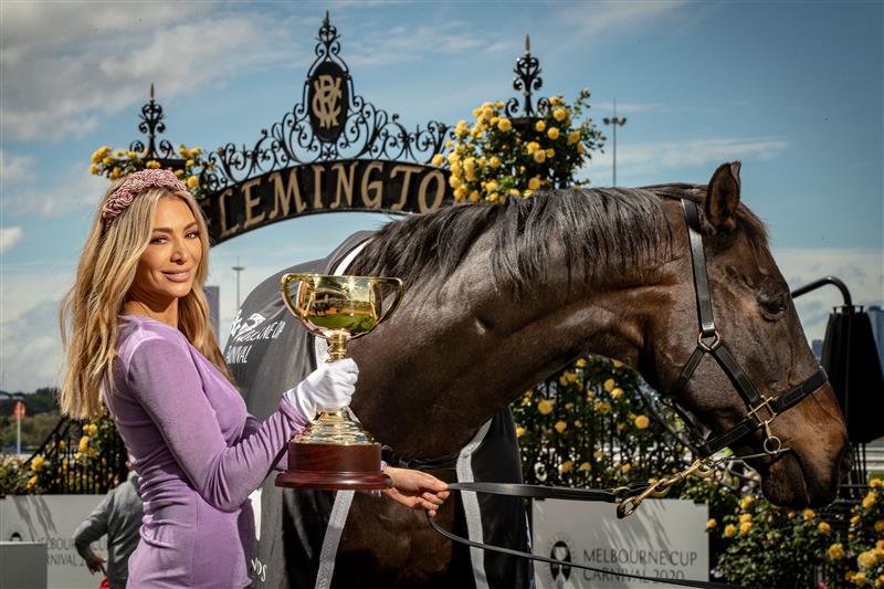 MELBOURNE, AUSTRALIA - OCTOBER 27: Melbourne Cup Carnival Ambassador Nadia Bartel poses with the Melbourne Cup and 2000 Melbourne Cup Winner 'Brew' at the Melbourne Cup Carnival launch at Flemington Racecourse on October 27, 2020 in Melbourne, Australia. (Photo by Darrian Traynor/Getty Images)
