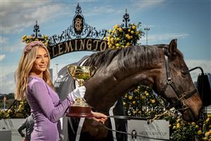 MELBOURNE, AUSTRALIA - OCTOBER 27: Melbourne Cup Carnival Ambassador Nadia Bartel poses with the Melbourne Cup and 2000 Melbourne Cup Winner 'Brew' at the Melbourne Cup Carnival launch at Flemington Racecourse on October 27, 2020 in Melbourne, Australia. (Photo by Darrian Traynor/Getty Images)