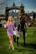 MELBOURNE, AUSTRALIA - OCTOBER 27: Melbourne Cup Carnival Ambassador Nadia Bartel poses with the Melbourne Cup and 2000 Melbourne Cup Winner 'Brew' at the Melbourne Cup Carnival launch at Flemington Racecourse on October 27, 2020 in Melbourne, Australia. (Photo by Darrian Traynor/Getty Images)