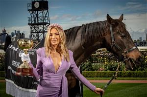MELBOURNE, AUSTRALIA - OCTOBER 27: Melbourne Cup Carnival Ambassador Nadia Bartel poses with the Melbourne Cup and 2000 Melbourne Cup Winner 'Brew' at the Melbourne Cup Carnival launch at Flemington Racecourse on October 27, 2020 in Melbourne, Australia. (Photo by Darrian Traynor/Getty Images)