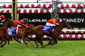 MELBOURNE, AUSTRALIA - NOVEMBER 05: Jordan Childs riding #9 Dosh wins race two the Darley Ottawa Stakes from Hugh Bowman riding #12 Nice For What and Craig Williams riding #6 Butter Blonde during 2020 Kennedy Oaks Day at Flemington Racecourse on November 05, 2020 in Melbourne, Australia. (Photo by Robert Cianflone/Getty Images for the VRC)