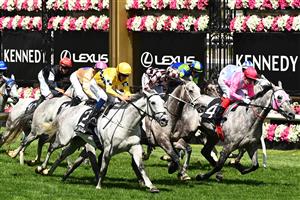 MELBOURNE, AUSTRALIA - NOVEMBER 05: Hugh Bowman riding #2 Berdibek wins race five the Off The Track Subzero Handicap during 2020 Kennedy Oaks Day at Flemington Racecourse on November 05, 2020 in Melbourne, Australia. (Photo by Quinn Rooney/Getty Images for the VRC)