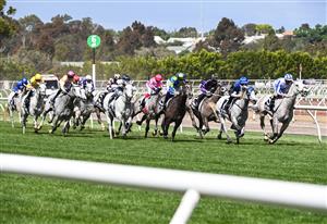 MELBOURNE, AUSTRALIA - NOVEMBER 05: Jockey Hugh Bowman riding Berdibek (yellow far left) before winning race 5, the Off The Track Subzero Handicap, during 2020 Kennedy Oaks Day at Flemington Racecourse on November 05, 2020 in Melbourne, Australia. (Photo by Vince Caligiuri/Getty Images for the VRC)