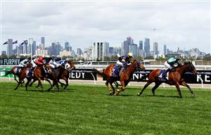 MELBOURNE, AUSTRALIA - NOVEMBER 05: Daniel Stackhouse riding #4 Irish Flame leads the field to go on and win race four the Twitter Trophy from Jamie Kah riding #1 Hang Man during 2020 Kennedy Oaks Day at Flemington Racecourse on November 05, 2020 in Melbourne, Australia. (Photo by Robert Cianflone/Getty Images for the VRC)
