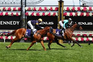 MELBOURNE, AUSTRALIA - NOVEMBER 05: Daniel Stackhouse riding #4 Irish Flame wins race four the Twitter Trophy from Jamie Kah riding #1 Hang Man during 2020 Kennedy Oaks Day at Flemington Racecourse on November 05, 2020 in Melbourne, Australia. (Photo by Robert Cianflone/Getty Images for the VRC)