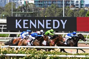 MELBOURNE, AUSTRALIA - NOVEMBER 05: Jockey Kerrin McEvoy riding Tralee Rose (green) to win Race 1, the Tcl Tv Stakes, during 2020 Kennedy Oaks Day at Flemington Racecourse on November 05, 2020 in Melbourne, Australia. (Photo by Vince Caligiuri/Getty Images for the VRC)