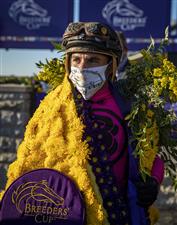 LEXINGTON, KY - NOVEMBER 07: Joel Rosario, rider of Vequist, drapes flowers over his shoulders in the winners circle after winning the Juvenile Fillies race during the Breeders Cup at Keenland on November 6, 2020 in Lexington, Kentucky. (Photo by Bobby Ellis/Getty Images)