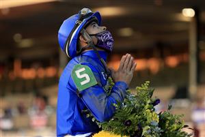 LEXINGTON, KENTUCKY - NOVEMBER 06: Luis Saez celebrates after riding Essential Quality to victory in the Breeder's Cup Juvenile during the 2020 Breeder's Cup at Keeneland on November 06, 2020 in Lexington, Kentucky. (Photo by Andy Lyons/Getty Images)