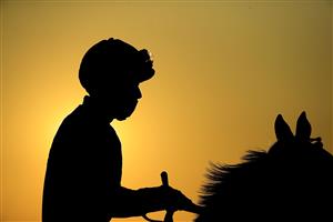 LEXINGTON, KENTUCKY - NOVEMBER 06: The sun sets on the jockeys before the start of the Breeder's Cup Juvenile during the 2020 Breeder's Cup at Keeneland on November 06, 2020 in Lexington, Kentucky. (Photo by Andy Lyons/Getty Images)