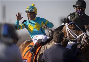 LEXINGTON, KY - NOVEMBER 07: Ricardo Santana, Jr., riding Fire at Will, celebrates after winning the Juvenile Turf on the first day of the Breeders Cup at Keenland on November 6, 2020 in Lexington, Kentucky. (Photo by Bobby Ellis/Getty Images)