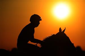 LEXINGTON, KENTUCKY - NOVEMBER 06: The sun sets on the jockeys before the start of the Breeder's Cup Juvenile during the 2020 Breeder's Cup at Keeneland on November 06, 2020 in Lexington, Kentucky. (Photo by Andy Lyons/Getty Images)