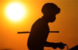 LEXINGTON, KENTUCKY - NOVEMBER 06: The sun sets on the jockeys before the start of the Breeder's Cup Juvenile during the 2020 Breeder's Cup at Keeneland on November 06, 2020 in Lexington, Kentucky. (Photo by Andy Lyons/Getty Images)