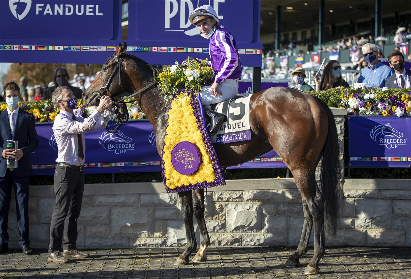 LEXINGTON, KY - NOVEMBER 07: Christophe Soumillon, riding Order of Australia, celebrates after winning the Breeders Cup Mile at Keenland on November 6, 2020 in Lexington, Kentucky. (Photo by Bobby Ellis/Getty Images)