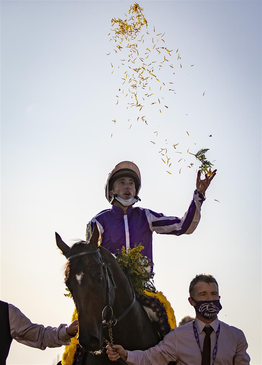 LEXINGTON, KY - NOVEMBER 07: Christophe Soumillon, riding Order of Australia, celebrates after winning the Breeders Cup Mile at Keenland on November 6, 2020 in Lexington, Kentucky. (Photo by Bobby Ellis/Getty Images)