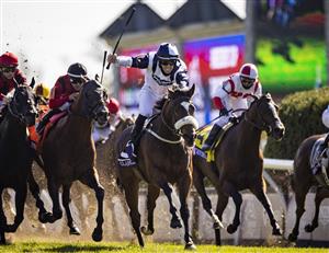 LEXINGTON, KY - NOVEMBER 07: Tom Eaves, riding Glass Slippers, celebrates as he crosses the finish line to win the Turf Sprint on the second day of the Breeders Cup at Keenland on November 6, 2020 in Lexington, Kentucky. (Photo by Bobby Ellis/Getty Images)