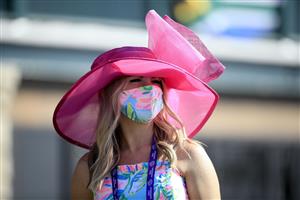 LEXINGTON, KENTUCKY - NOVEMBER 07:   A fan watches the action during 2020 Breeders' Cup at Keeneland on November 07, 2020 in Lexington, Kentucky. (Photo by Andy Lyons/Getty Images)