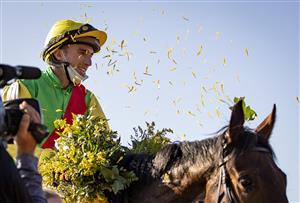 LEXINGTON, KY - NOVEMBER 07: Pierre-Charles Boudot celebrates after winning the Breeders Cup Filly and Mare Turf race on Audarya at Keenland on November 6, 2020 in Lexington, Kentucky. (Photo by Bobby Ellis/Getty Images)