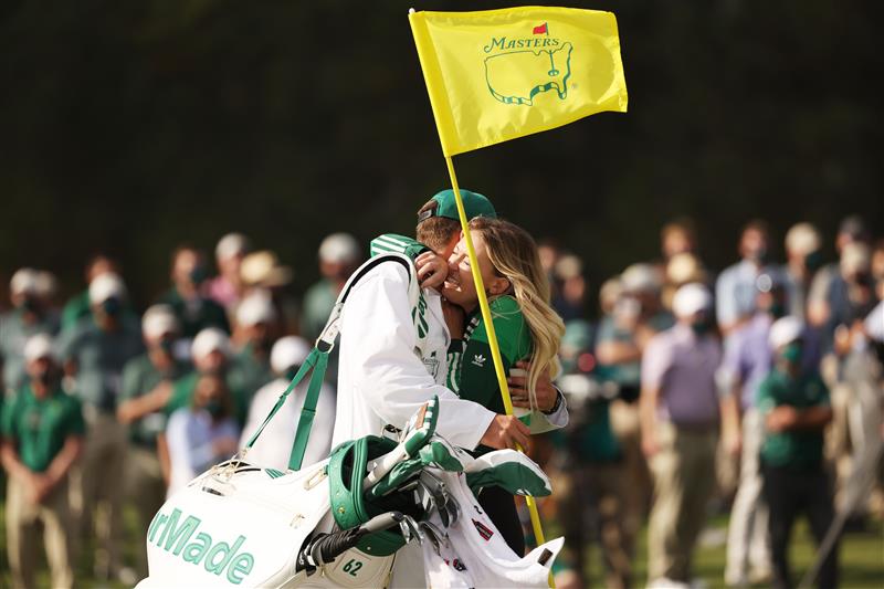 Paulina Gretzky, fiancée of Dustin Johnson of the United States (not pictured), celebrates with caddie Austin Johnson on the 18th green after Dustin Johnson won the Masters at Augusta National Golf Club (Photo by Getty Images)