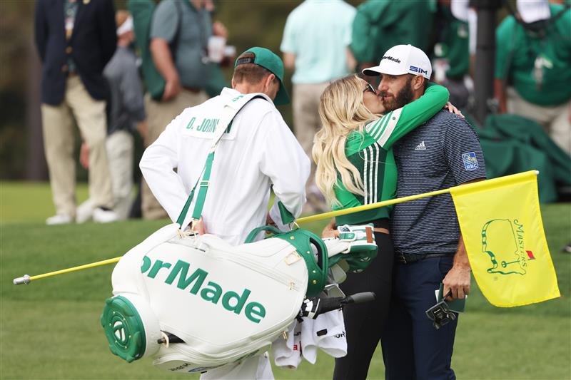 Dustin Johnson kisses fiancée Paulina Gretzky after winning the Masters at Augusta National Golf Club (Photo by Getty Images)