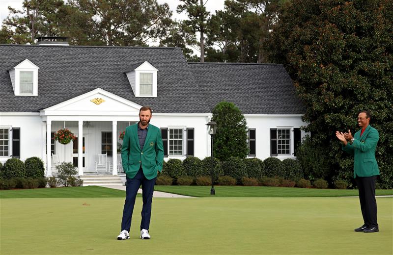 Dustin Johnson is awarded the Green Jacket by Masters champion Tiger Woods during the Green Jacket Ceremony after winning the Masters at Augusta National Golf Club (Photo by Getty Images)