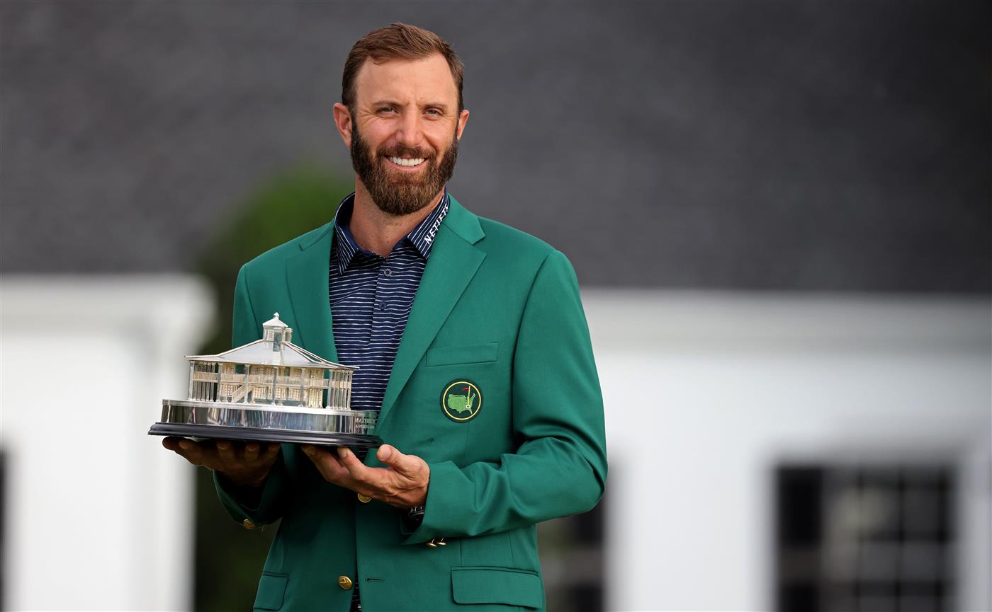 Dustin Johnson of the United States poses with the Masters Trophy during the Green Jacket Ceremony after winning the Masters at Augusta National Golf Club (Photo by Getty Images)