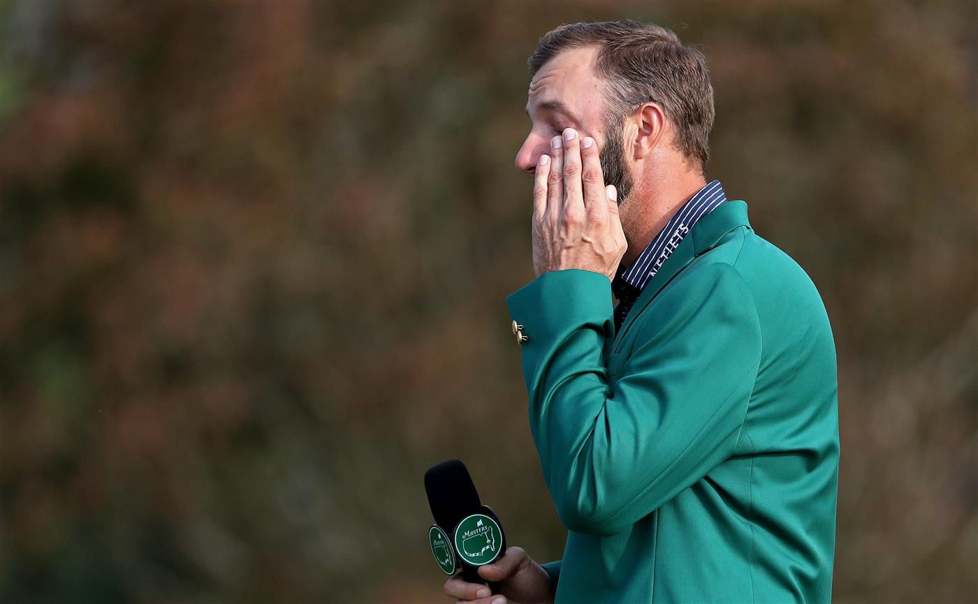 Dustin Johnson reacts as he is interviewed during the Green Jacket Ceremony after winning the Masters at Augusta National Golf Club (Photo by Getty Images)