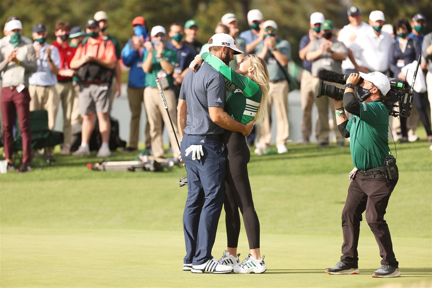 Dustin Johnson kisses fiancée Paulina Gretzky after winning the Masters at Augusta National Golf Club (Photo by Getty Images)