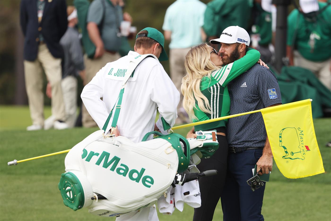 Dustin Johnson kisses fiancée Paulina Gretzky after winning the Masters at Augusta National Golf Club (Photo by Getty Images)
