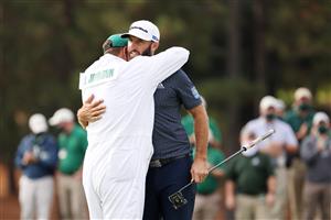 Dustin Johnson of the United States celebrates with caddie Austin Johnson on the 18th green after winning the Masters at Augusta National Golf Club (Photo by Getty Images)