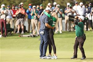 Dustin Johnson kisses fiancée Paulina Gretzky after winning the Masters at Augusta National Golf Club (Photo by Getty Images)