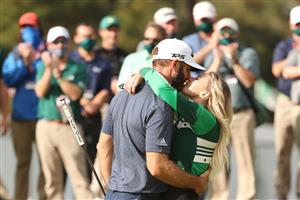 Dustin Johnson kisses fiancée Paulina Gretzky after winning the Masters at Augusta National Golf Club (Photo by Getty Images)