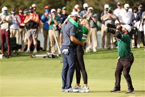 Dustin Johnson kisses fiancée Paulina Gretzky after winning the Masters at Augusta National Golf Club (Photo by Getty Images)