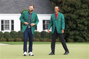 Dustin Johnson is awarded the Green Jacket by Masters champion Tiger Woods during the Green Jacket Ceremony after winning the Masters at Augusta National Golf Club (Photo by Getty Images)