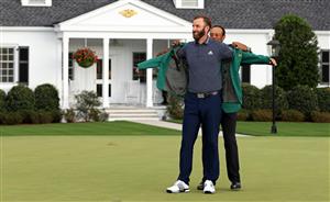 Dustin Johnson is awarded the Green Jacket by Masters champion Tiger Woods during the Green Jacket Ceremony after winning the Masters at Augusta National Golf Club (Photo by Getty Images)