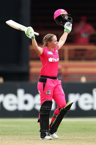 SYDNEY, AUSTRALIA - NOVEMBER 22: Alyssa Healy of the Sixers celebrates scoring a century during the Women's Big Bash League WBBL match between the Melbourne Stars and the Sydney Sixers at North Sydney Oval, on November 22, 2020, in Sydney, Australia. (Photo by Cameron Spencer/Getty Images)