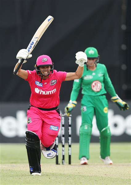 SYDNEY, AUSTRALIA - NOVEMBER 22: Angela Reakes of the Sixers celebrates hitting the winning runs during the Women's Big Bash League WBBL match between the Melbourne Stars and the Sydney Sixers at North Sydney Oval, on November 22, 2020, in Sydney, Australia. (Photo by Cameron Spencer/Getty Images)