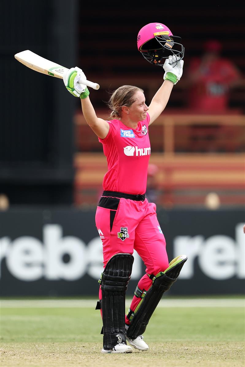 SYDNEY, AUSTRALIA - NOVEMBER 22: Alyssa Healy of the Sixers celebrates scoring a century during the Women's Big Bash League WBBL match between the Melbourne Stars and the Sydney Sixers at North Sydney Oval, on November 22, 2020, in Sydney, Australia. (Photo by Cameron Spencer/Getty Images)