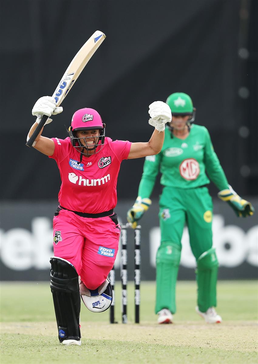 SYDNEY, AUSTRALIA - NOVEMBER 22: Angela Reakes of the Sixers celebrates hitting the winning runs during the Women's Big Bash League WBBL match between the Melbourne Stars and the Sydney Sixers at North Sydney Oval, on November 22, 2020, in Sydney, Australia. (Photo by Cameron Spencer/Getty Images)