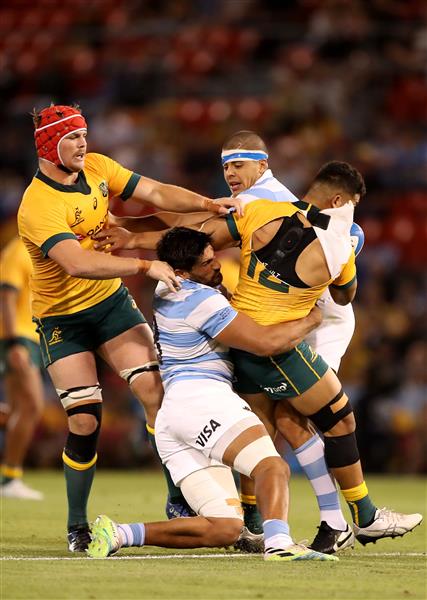 NEWCASTLE, AUSTRALIA - NOVEMBER 21: Hunter Paisami of the Wallabies is tackled during the 2020 Tri-Nations match between the Australian Wallabies and the Argentina Pumas at McDonald Jones Stadium on November 21, 2020 in Newcastle, Australia. (Photo by Mark Kolbe/Getty Images)