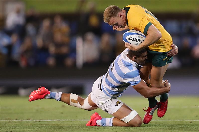 NEWCASTLE, AUSTRALIA - NOVEMBER 21: Reece Hodge of the Wallabies is tackled by Pablo Matera of the Pumas during the 2020 Tri-Nations match between the Australian Wallabies and the Argentina Pumas at McDonald Jones Stadium on November 21, 2020 in Newcastle, Australia. (Photo by Mark Metcalfe/Getty Images)