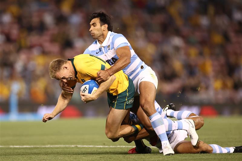 NEWCASTLE, AUSTRALIA - NOVEMBER 21: Reece Hodge of Australia is tackled during the 2020 Tri-Nations match between the Australian Wallabies and the Argentina Pumas at McDonald Jones Stadium on November 21, 2020 in Newcastle, Australia. (Photo by Cameron Spencer/Getty Images)
