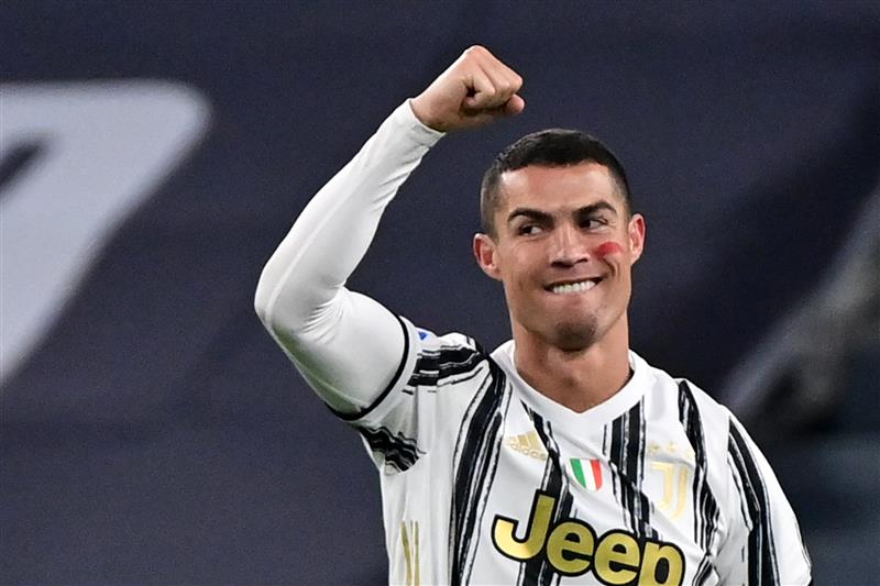 Portuguese forward Cristiano Ronaldo celebrates after opening the scoring during the Italian Serie A football match Juventus vs Cagliari on November 21, 2020 at the Juventus stadium in Turin. (Photo by MIGUEL MEDINA / AFP) (Photo by MIGUEL MEDINA/AFP via Getty Images)