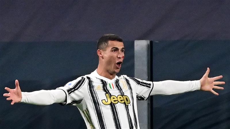 Portuguese forward Cristiano Ronaldo celebrates after scoring his second goal during the Italian Serie A football match Juventus vs Cagliari on November 21, 2020 at the Juventus stadium in Turin. (Photo by MIGUEL MEDINA / AFP) (Photo by MIGUEL MEDINA/AFP via Getty Images)