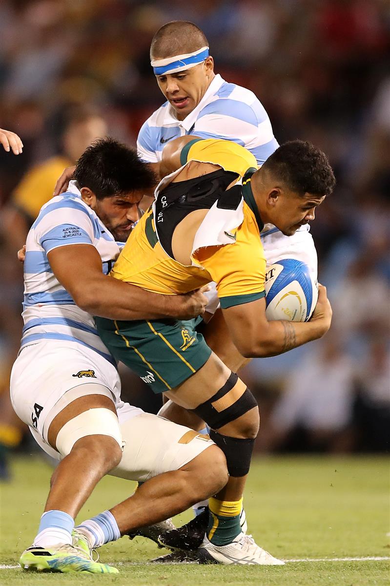 NEWCASTLE, AUSTRALIA - NOVEMBER 21: Hunter Paisami of the Wallabies is tackled during the 2020 Tri-Nations match between the Australian Wallabies and the Argentina Pumas at McDonald Jones Stadium on November 21, 2020 in Newcastle, Australia. (Photo by Mark Kolbe/Getty Images)